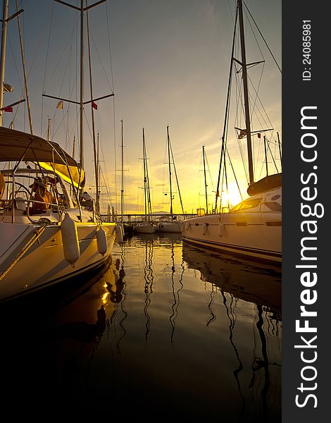 Yachts at a wharf in the evening