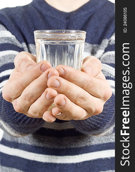Hands holding a glass of water isolated on white background
