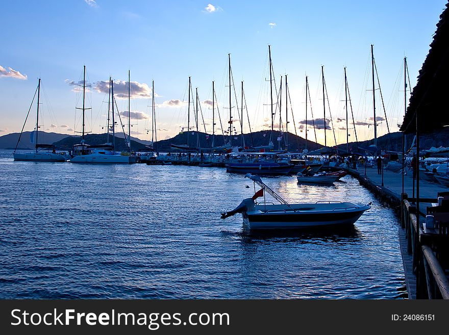 Yachts at a wharf in the evening. Yachts at a wharf in the evening