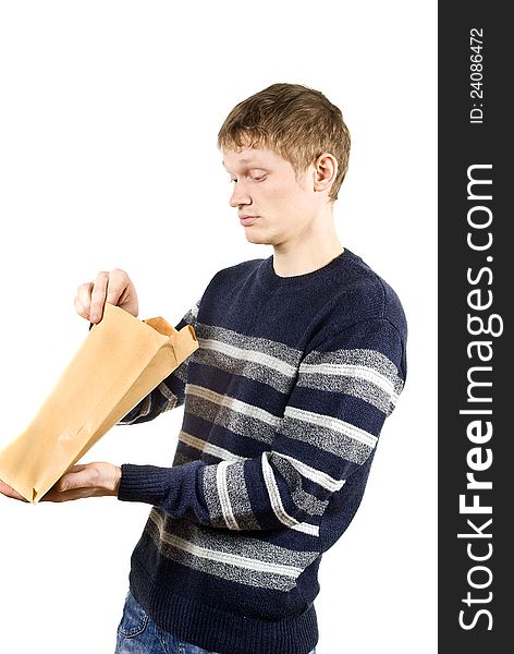 The guy looks at the parcel isolated on white background. The guy looks at the parcel isolated on white background