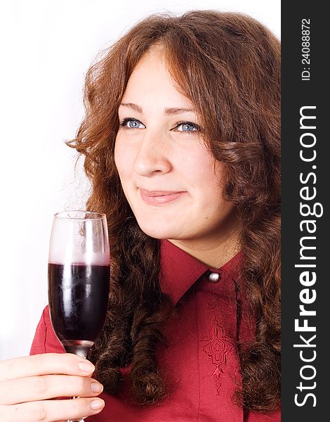 Closeup of beautiful female lips drinking wine from a glass with dewdrops on it.