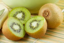 Kiwi Sliced And Whole Fruits, Green Bowl Stock Photography Kiwi Sliced And Whole Fruits, Green Bowl Stock Photography