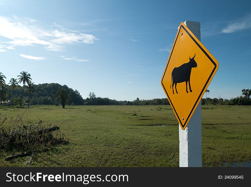 Animal warning sign on the green field