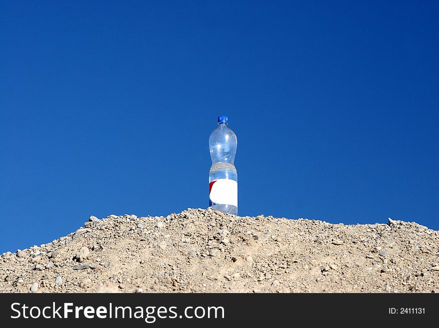 Bottle of water on the hill on a heat day. Bottle of water on the hill on a heat day