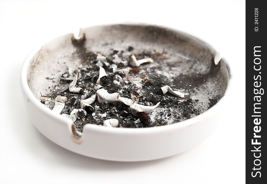 Ashtray filled with cigarettes on white background. Ashtray filled with cigarettes on white background