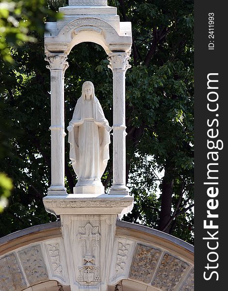 Statue of Virgin Mary in outdoor Grotto