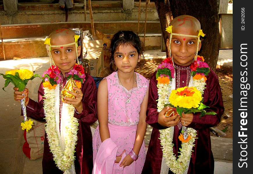 Brothers with their beloved sisters in a dress of an Indian monk after thread ceremony. Brothers with their beloved sisters in a dress of an Indian monk after thread ceremony.