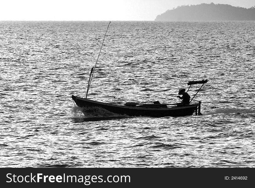 Profile of fishing boat off the coast of Rayong province in Thailand. Black and white photo