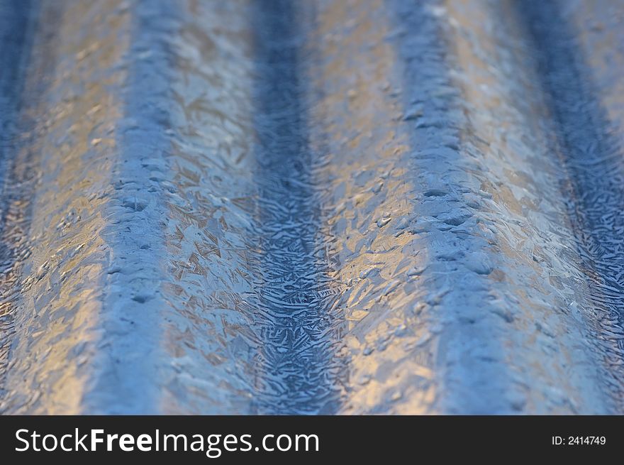 Corrugated roof makes an abstract background. Selective focus. Corrugated roof makes an abstract background. Selective focus.