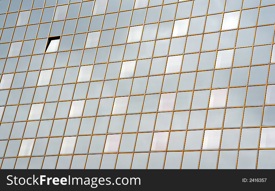 Modern business building with windows reflecting sun shine