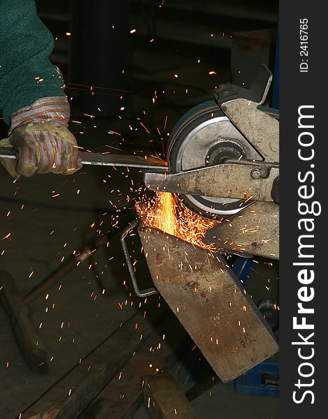 Steel being grinded in a mechanical workshop. Steel being grinded in a mechanical workshop