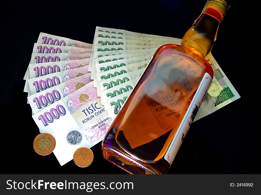 Czech money and whiskey bottle. Czech money and whiskey bottle