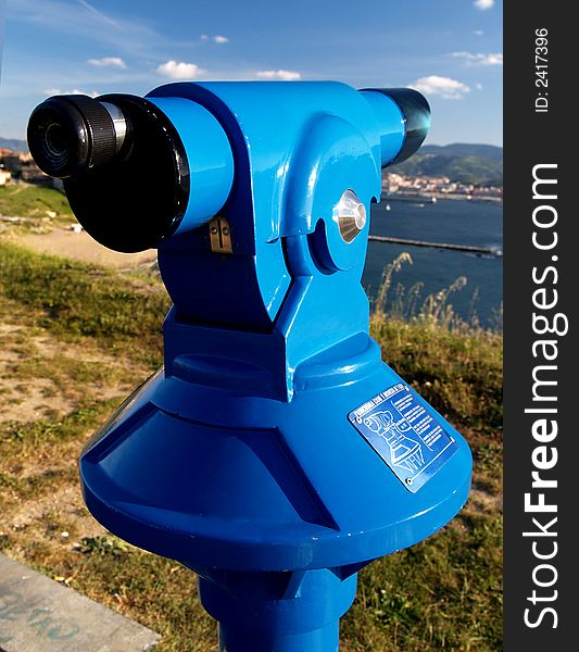 Coin operated blue telescope at algorta, spain