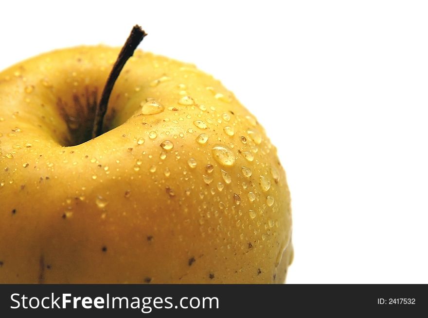 Detail of an ylelow apple with water drops. Detail of an ylelow apple with water drops