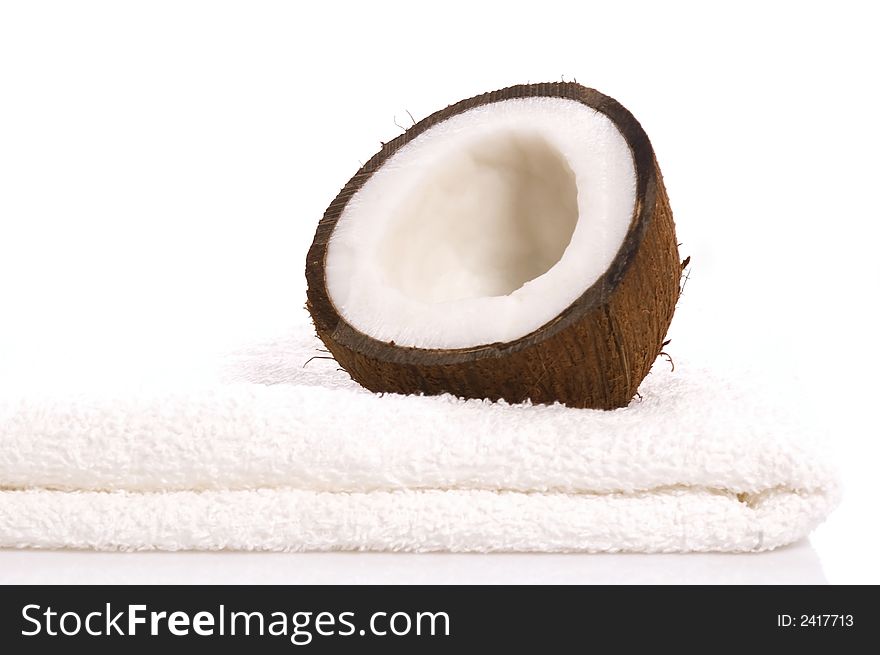 Coconut and white towel. exotic, tropical scene. beautyfarm. Coconut and white towel. exotic, tropical scene. beautyfarm