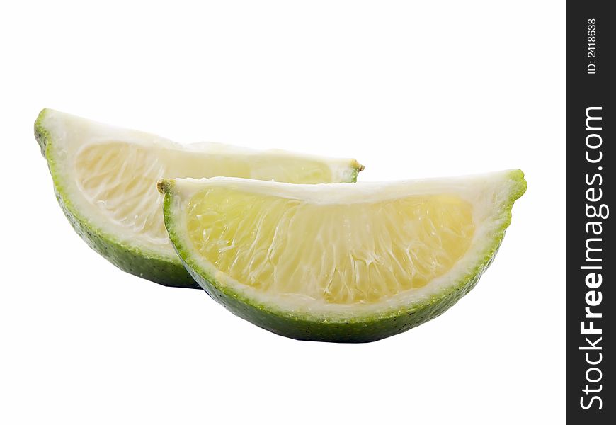 Photo of a sliced lime isolated on white