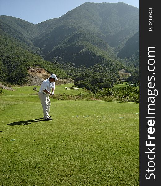 Player ready to make his swing. Player ready to make his swing