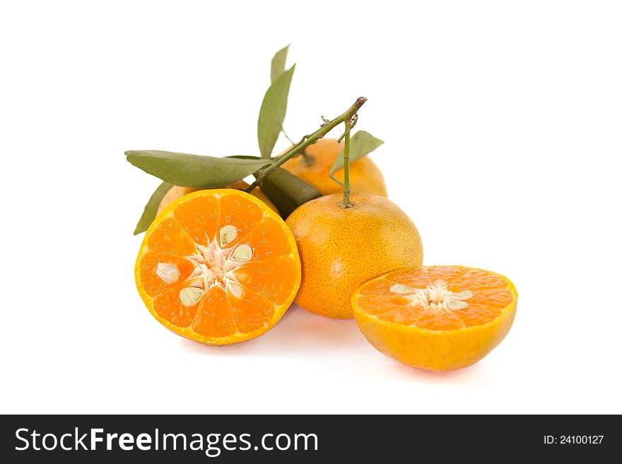 Orange fruit slice with leaves, on white background