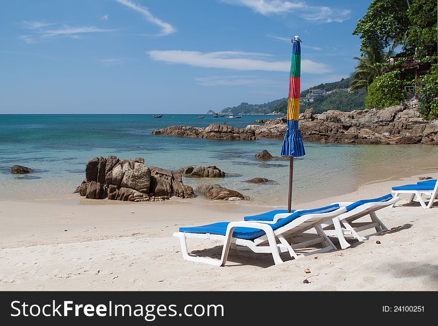 Loungers And Umbrella On The Beach