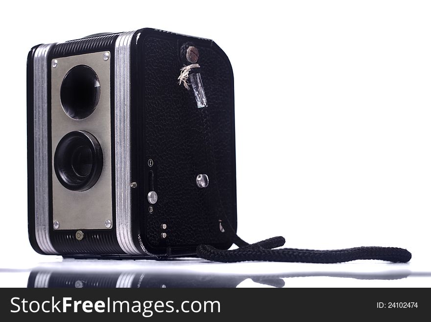 Close view of a vintage dual lenses reflex camera isolated on a white background. Close view of a vintage dual lenses reflex camera isolated on a white background.