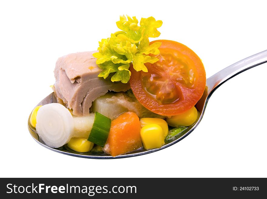 Tuna salad on a spoon isolated on white background