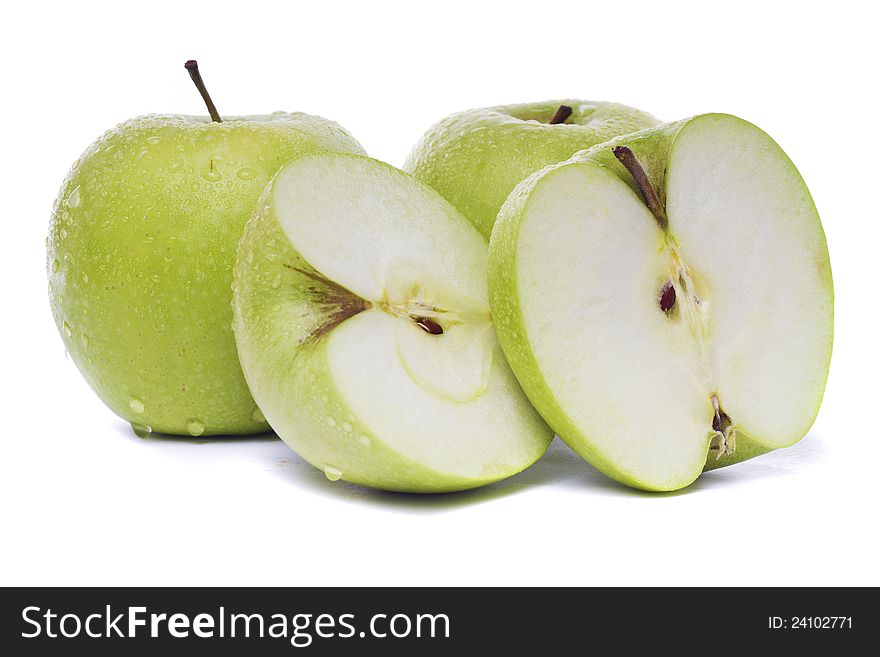 Close view of three fresh green apples isolated on a white background.