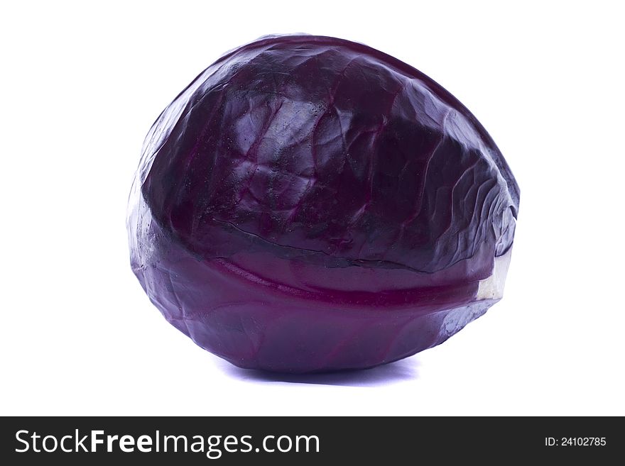 Close view of a red cabbage isolated on a white background.