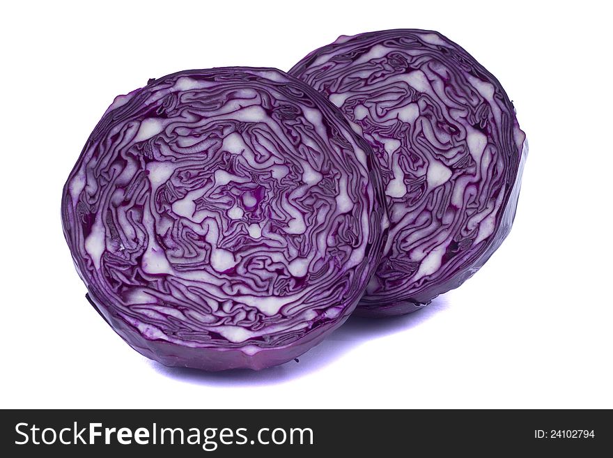 Close view of a sliced red cabbage isolated on a white background.