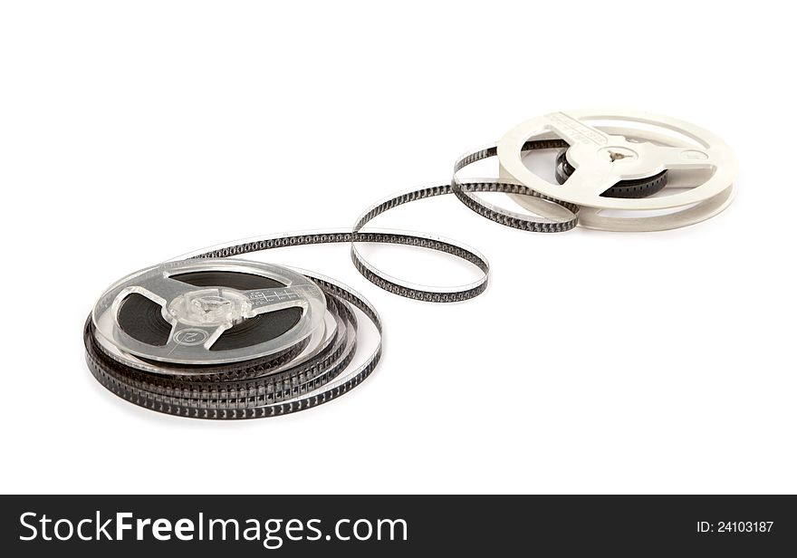 The spools of old spool-type ribbon lie alongside on a white background. The spools of old spool-type ribbon lie alongside on a white background