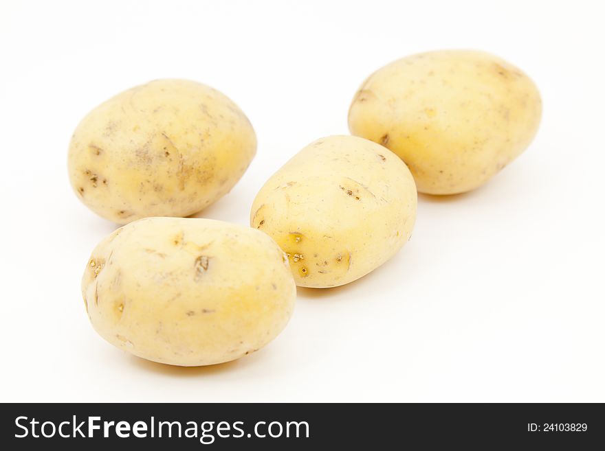 New potatoes and fresh on a white background. New potatoes and fresh on a white background