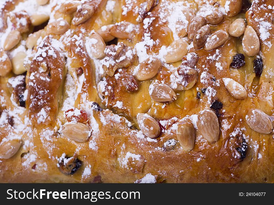 Close view of a traditional Portuguese Easter cake on a white background.