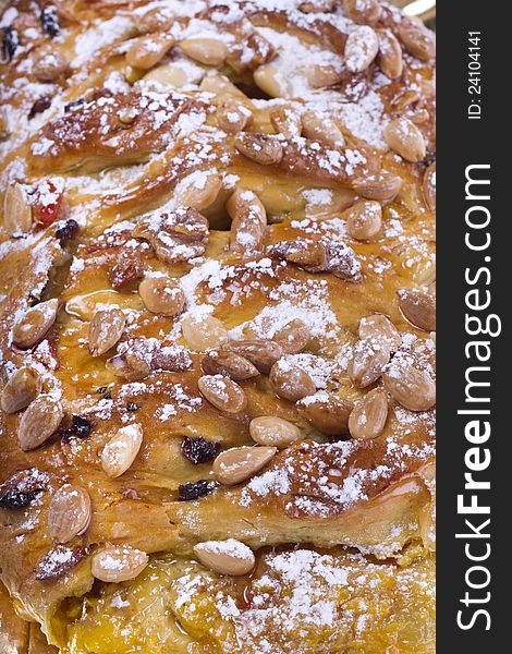 Close view of a traditional Portuguese Easter cake on a white background.