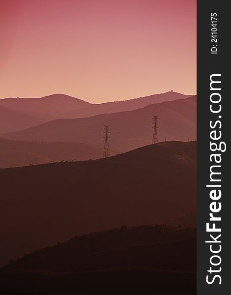 View of a eerie landscape with mountains at dawn.