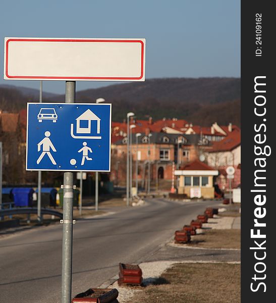 Traffic signs in front of a city. Traffic signs in front of a city.