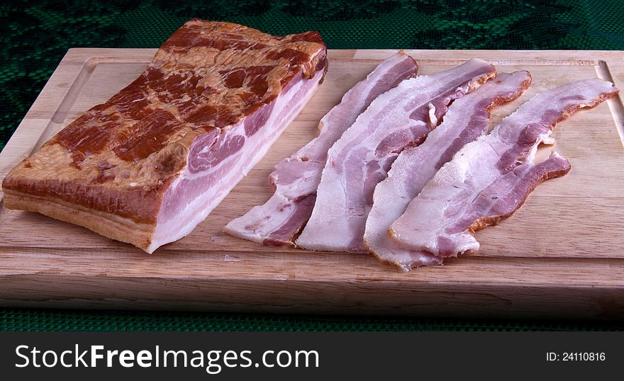 Bacon is cured in slabs and then sliced. Bacon is cured in slabs and then sliced