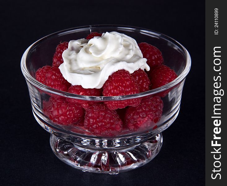 Fresh raspberries with whipped cream. Fresh raspberries with whipped cream.