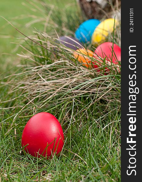 Different color Easter eggs- selective focus on the red egg