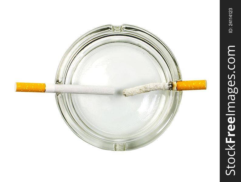 Cigarette in ashtray concept on white background
