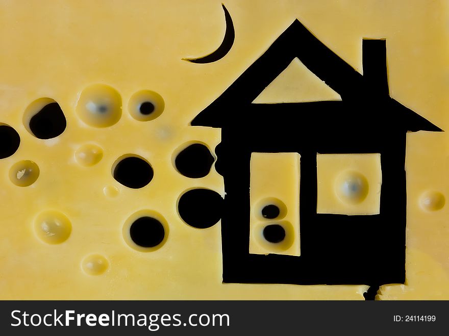 Picture of house frome sliced cheese on black background