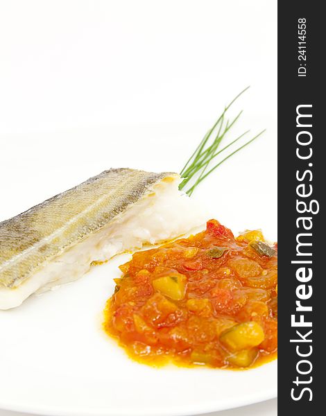 Fillet of cod with tomato sauce with vegetables