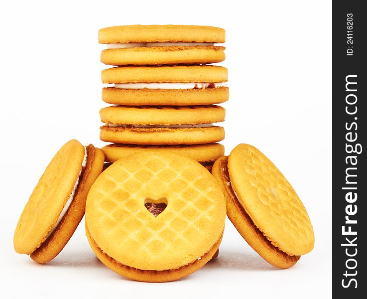 Closeup of a stack of filled cookies on white background