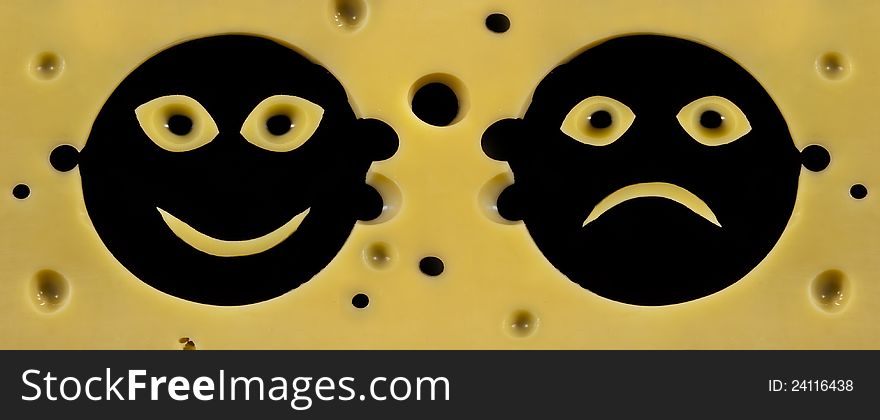 Smile faces positive and negative in hard cheese texture. Smile faces positive and negative in hard cheese texture