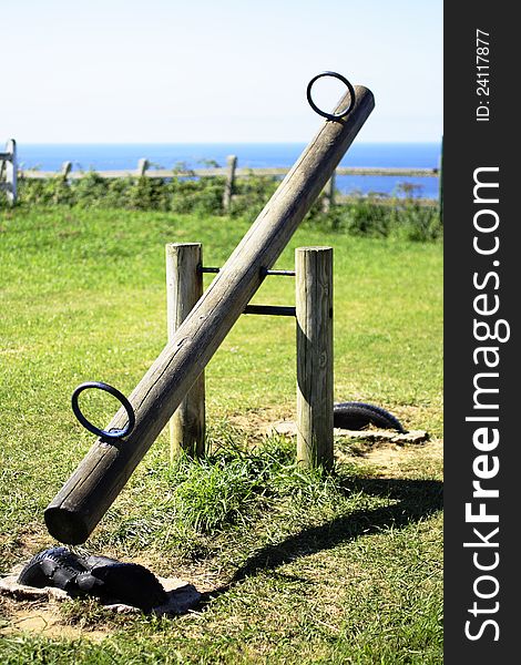 Equipment in a children's play park grass. Equipment in a children's play park grass