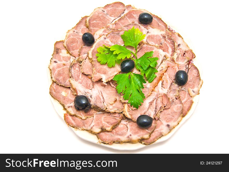 Meat with herbs on a plate on white