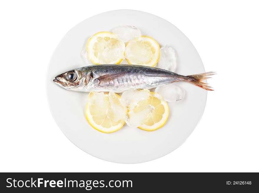 Mackerel in the bowl with the lemon. On a white background.