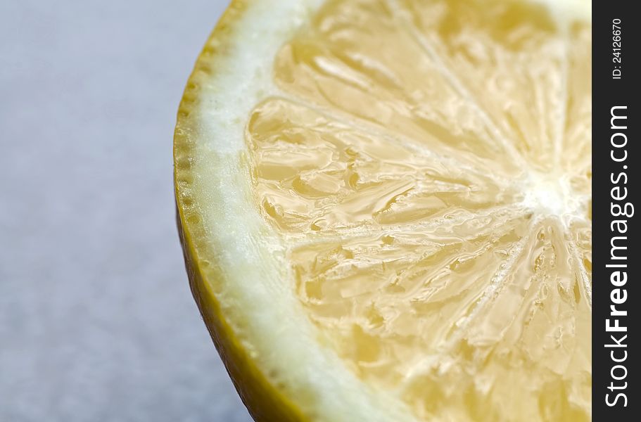 Photograph of a juicy tart slice of lemon