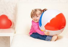 Portrait Of A Beautiful Little Girl Holding A Ball Stock Images