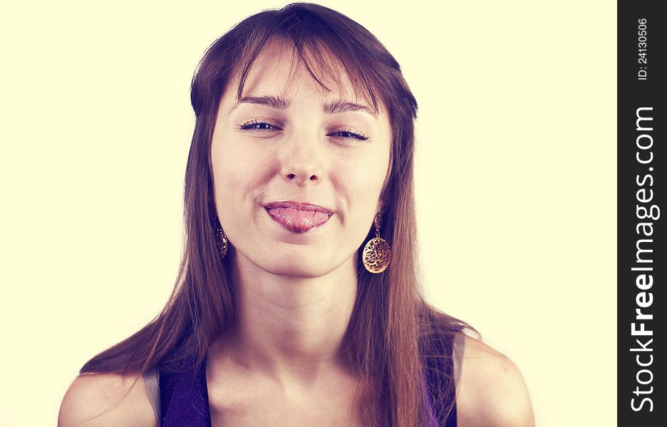 Portrait of young pretty woman with her tongue out, toned