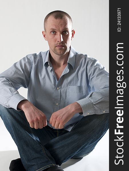 Portrait of serious young man in shirt. Portrait of serious young man in shirt