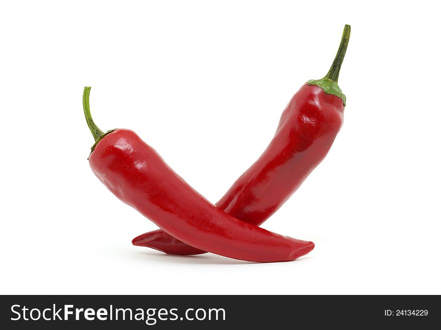 Fresh red hot pepper on a white